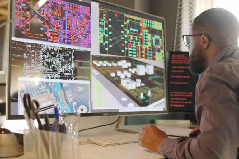 Engineer analyzing complex digital circuit designs.